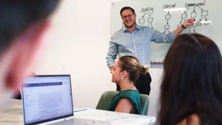 business man giving presentation to team