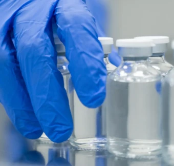 scientist hand working with vials