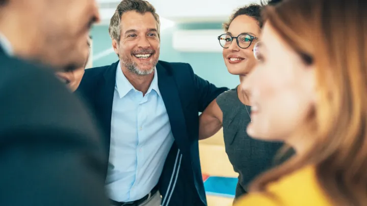 business team smiling during meeting